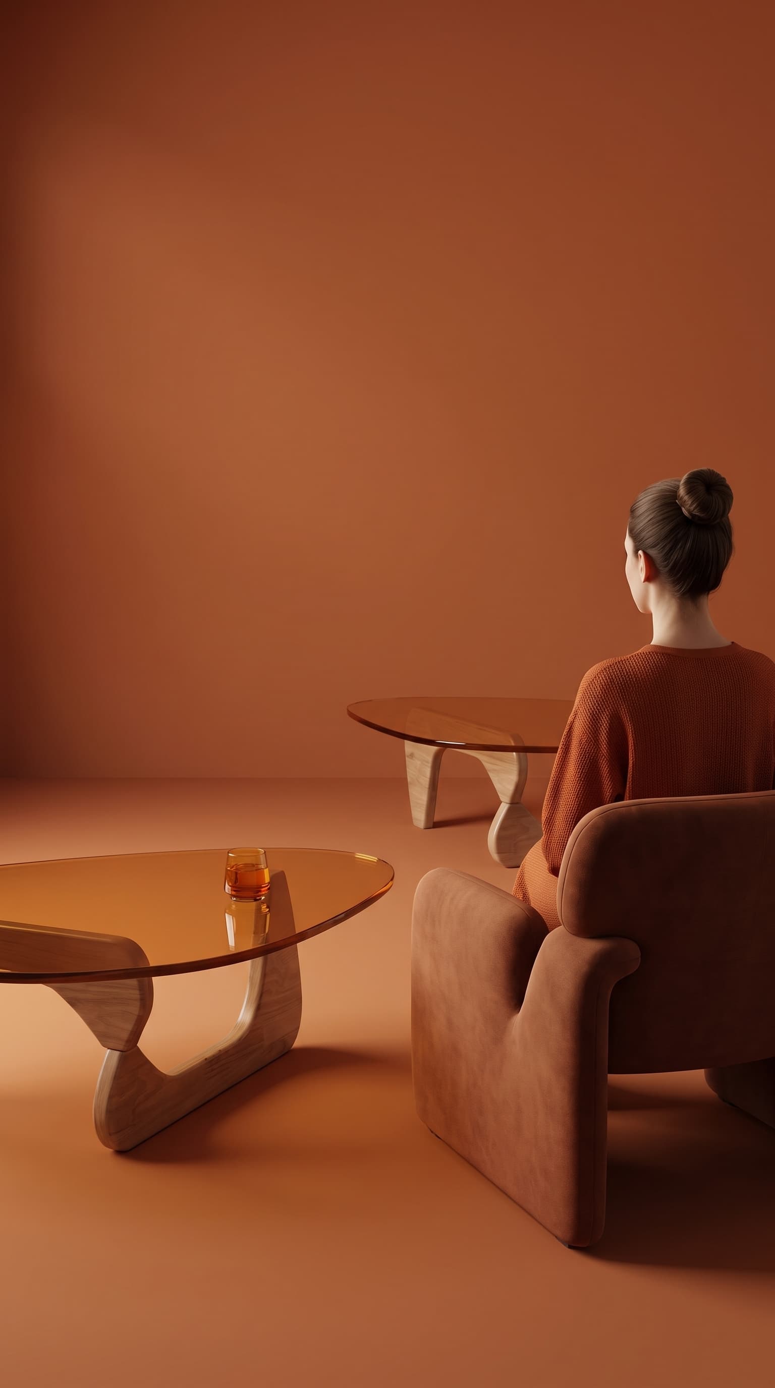 Same coffee table in a monochrome terracotta interior with a matching armchair